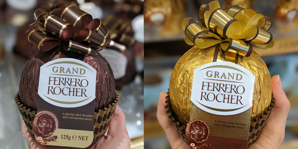 A dark and a milk chocolate giant ferrero ball. It is bigger than one's fist.