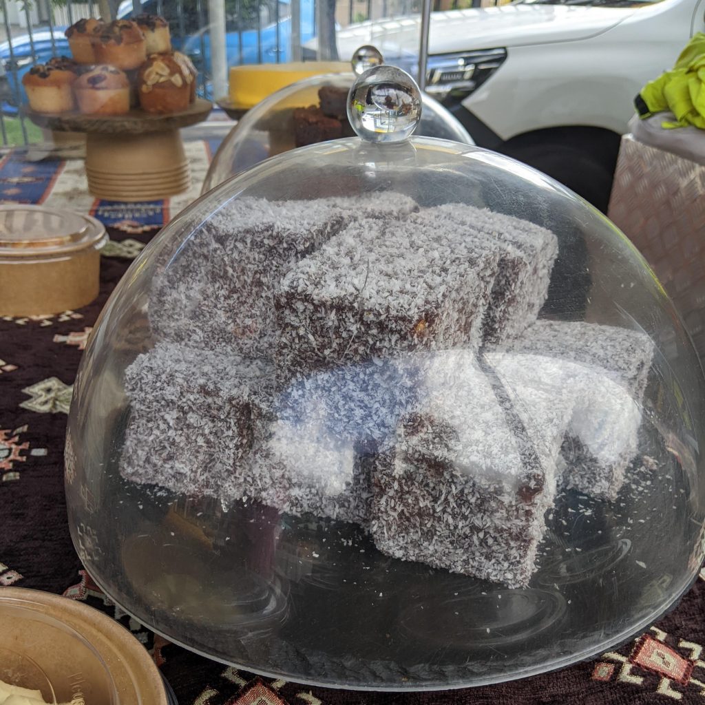 A covered tray of gluten free lamingtons.