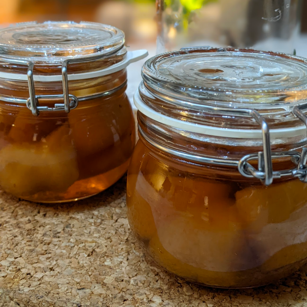 Two jars of stem ginger in syrup.
