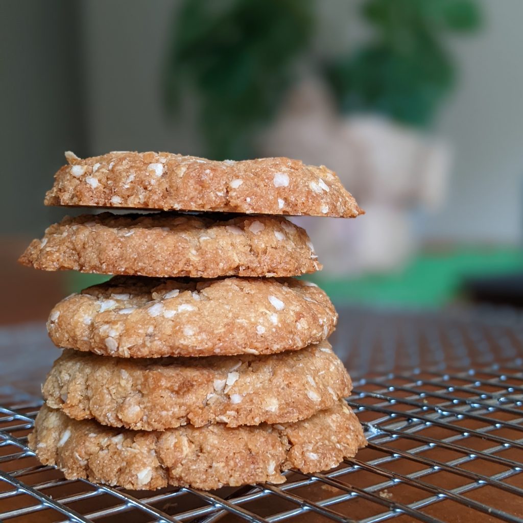 A stack of five gluten free oat free ANZAC biscuits.