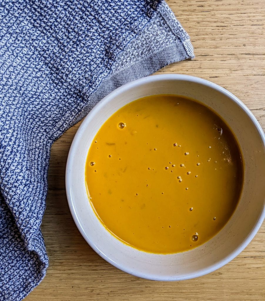Hart and soul pumpkin soup in a bowl.
