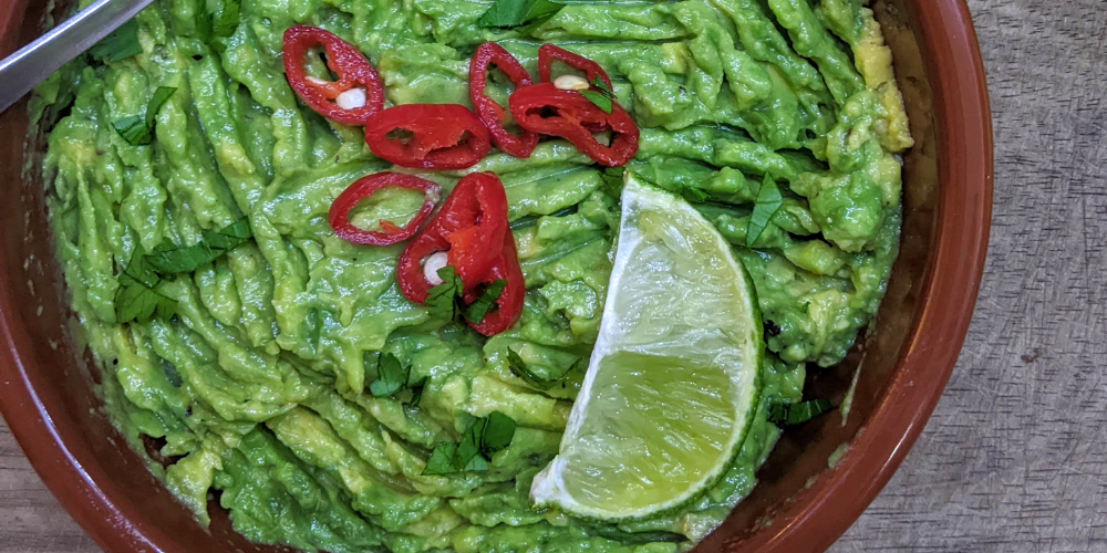 A bowl of guacamole. 