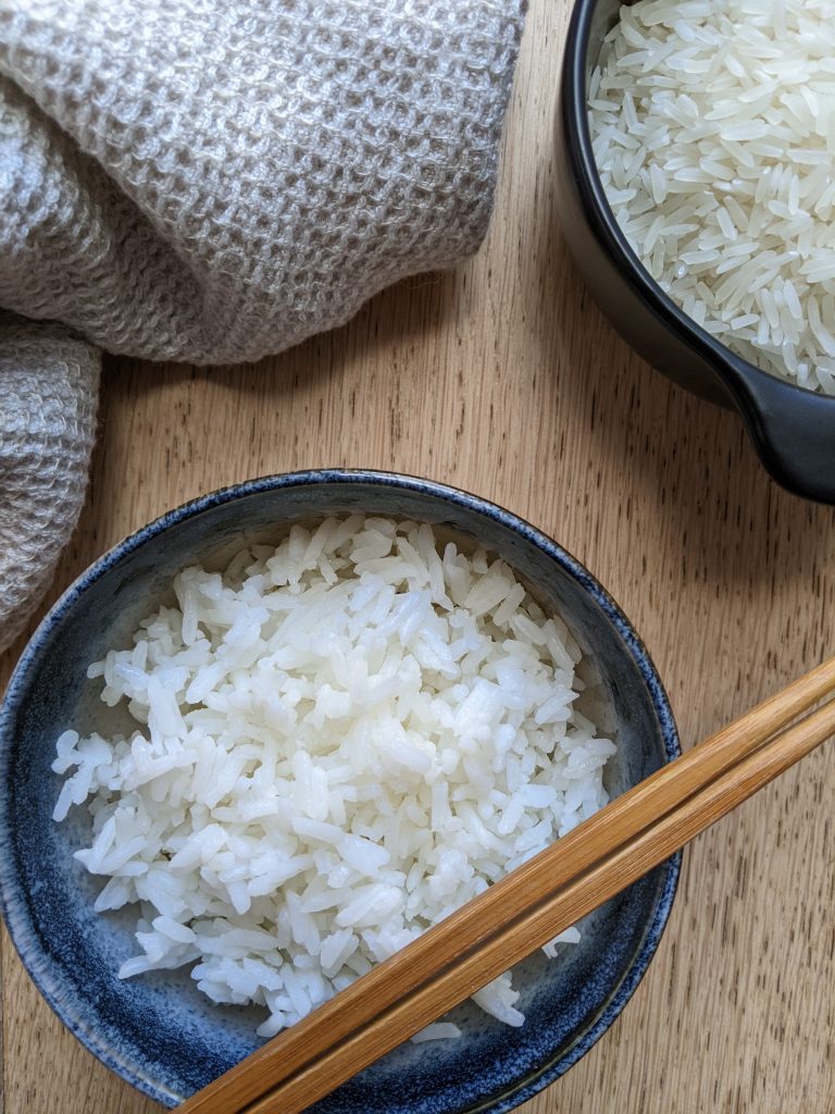 A bowl of white rice cooked in an instant pot.