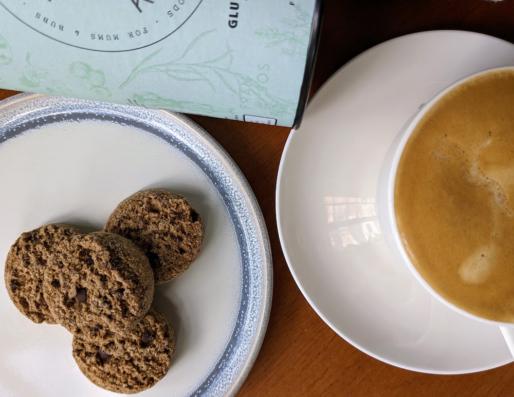 Four Franjos kitchen gluten free lactation biscuits on a plate and a cup of coffee