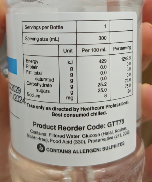 The label of the bottle for the glucose tolerance test. It lists filtered water, glucose (halal, Kosher, gluten free) Food acid (330), preservative (211, 202).