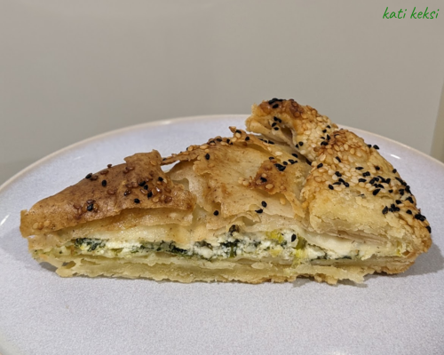 a plate with a slice of gluten free spanakopita