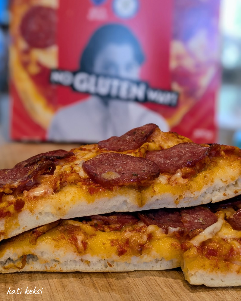 Cross section of a pepperoni pizza showing it's fluffy base.